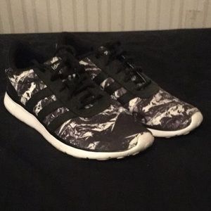 Black and white Adidas shoes